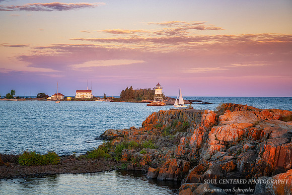 Grand Marais harbor and lighthouse in evening light, Oct. '25