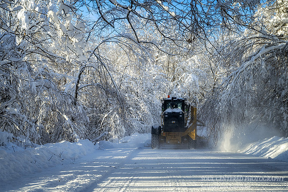 Winter road in the Blue Hills  with snow plow