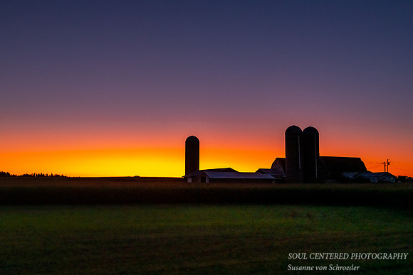 Summer evening with farm silhouette