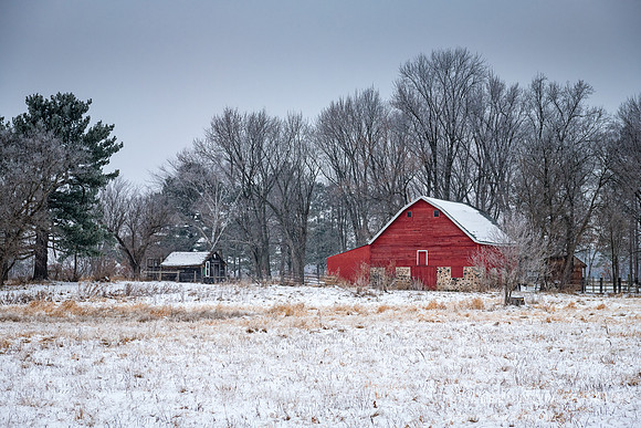 Little Red barn in winter landscape