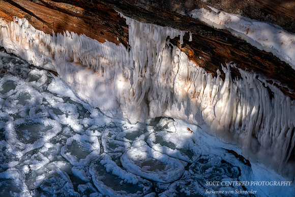 Red sandstone cliff and pancake ice 2