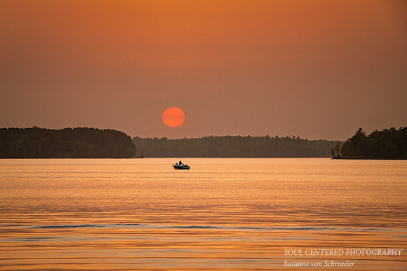Golden-red sunset, with boat, Chippewa Flowage, June '22