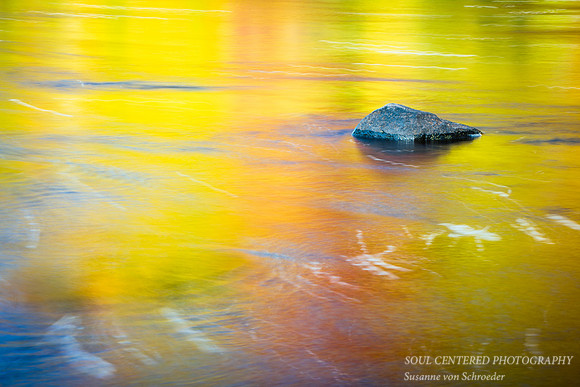 Rock in golden water 2