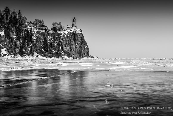 Lighthouse reflecting in ice, Black & White