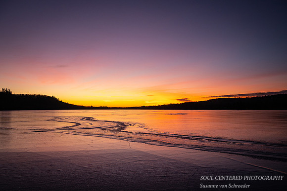 Sunset colors reflecting off the ice, Lax Lake, MN