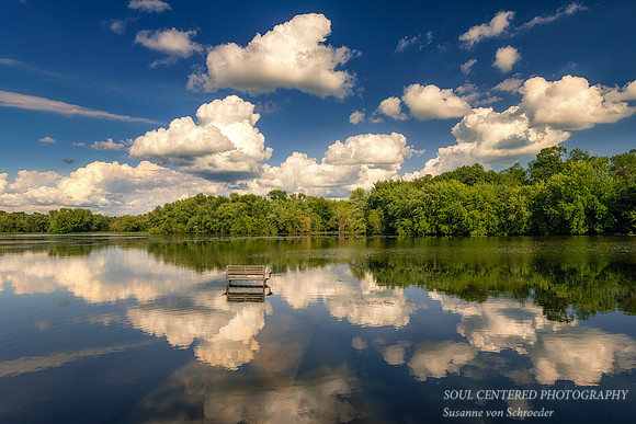 Cloud reflections with bench