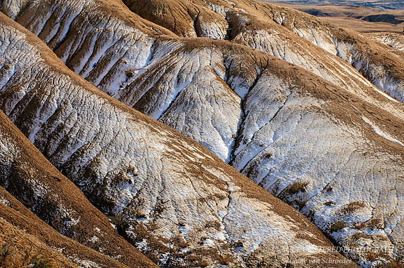 Badlands hills with snow dusting