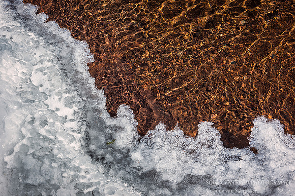 Ice and golden pebbles