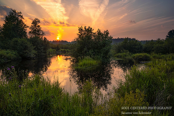 Sunset colors reflecting in a small river