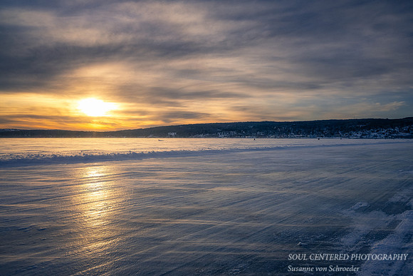 Ice road towards Bayfield at sunset