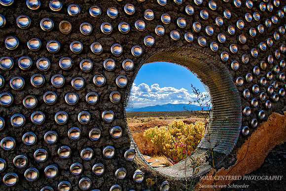 View through wall at Earthship house